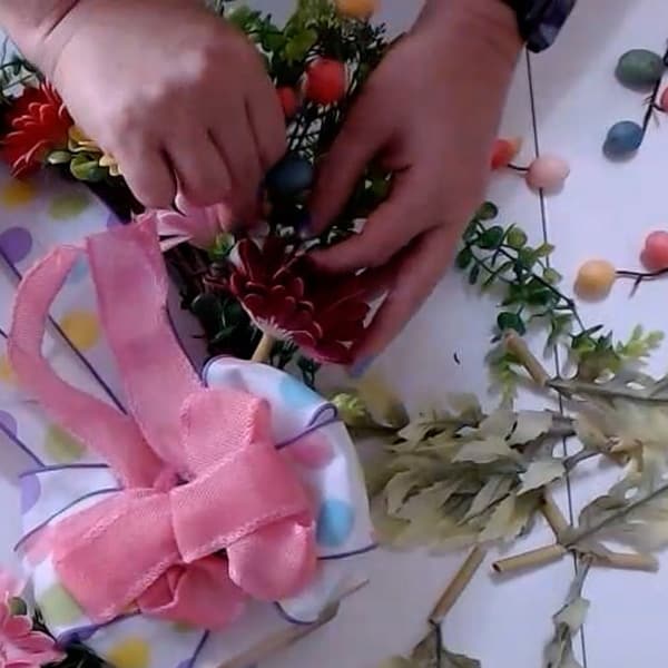 Add egg picks to wreath