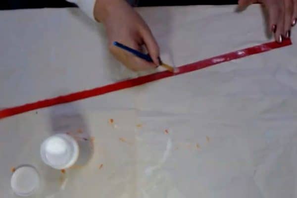 Putting Mod Modge on ribbon to weather proof ribbon - alifeofbalance.com