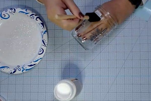 Painting Mod Podge on a mason jar - alifeofbalance.com