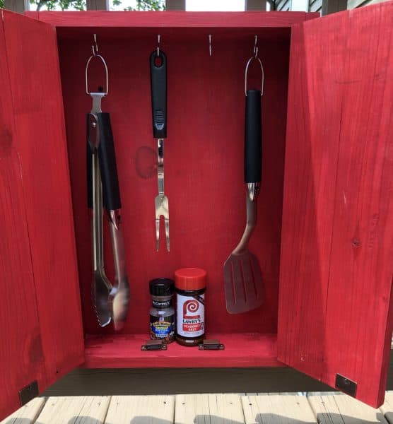 Grill tools and spices inside of grill tools organizer