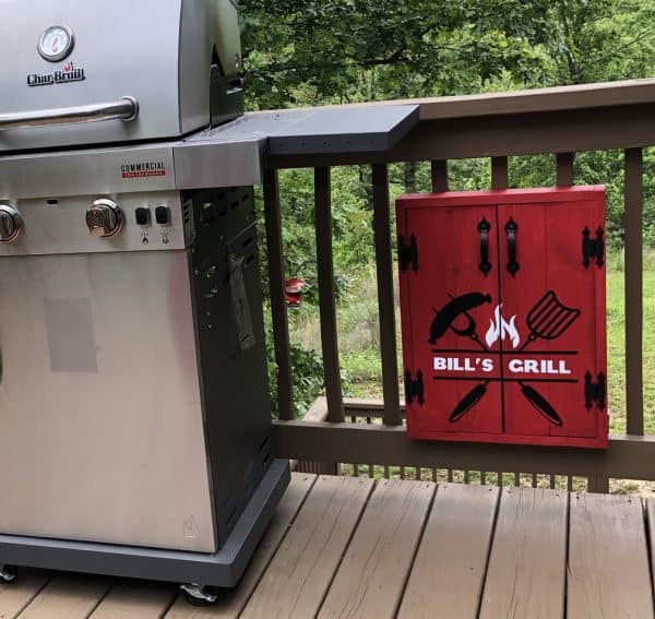Grill tools organizer mounted next to grill