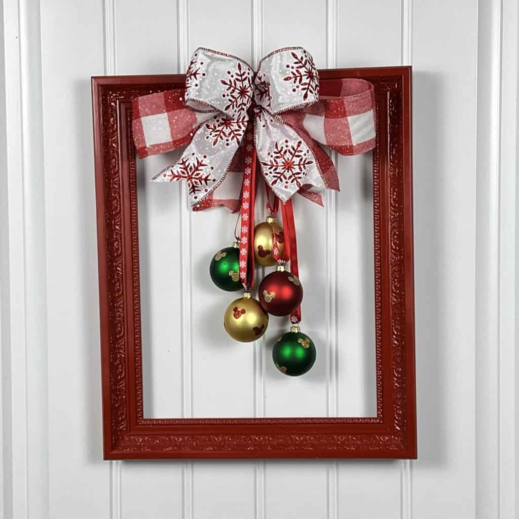 picture frame wreath with big bow and ornaments
