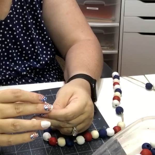 Assembling a wood bead garland ~ alifeofbalance.com