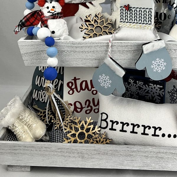 Two different fabric layers being used for a base when styling a tiered tray.
